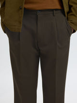 Brown pants on model zoomed