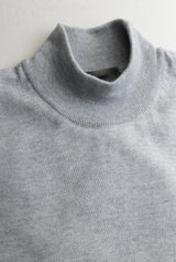 Grey sweater zoomed in
