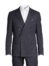 A navy double-breasted suit jacket displayed on a headless mannequin torso, styled with a crisp white dress shirt and a blue patterned pocket square, set against a plain white background.